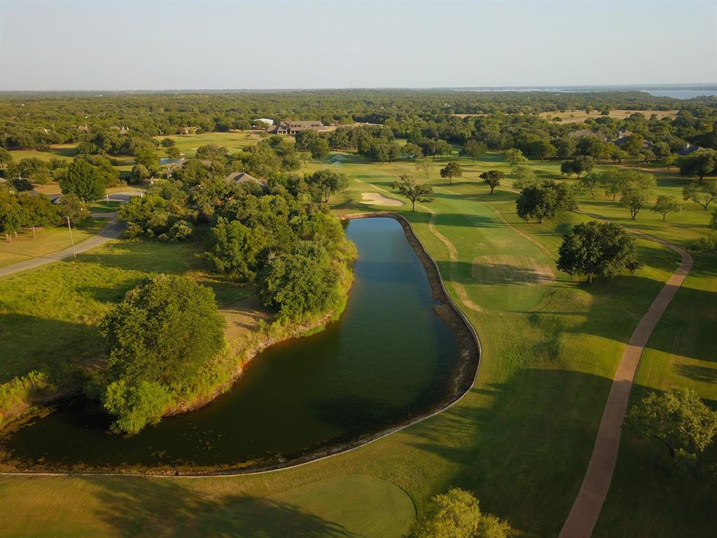 10057 Bluffview Court Whitney, TX 76692 - Photo 12 of 27 an aerial view of residential houses with outdoor space