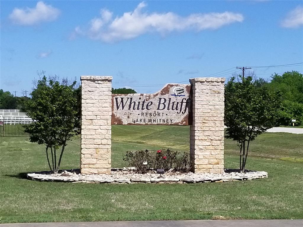 10057 Bluffview Court Whitney, TX 76692 - Photo 19 of 27 a front view of a house with garden