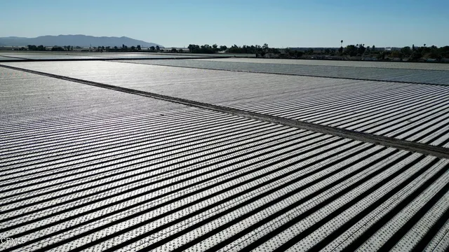 a view of swimming pool with a table and chairs