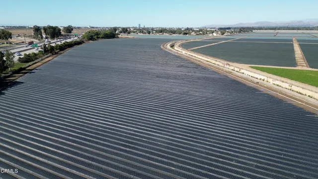 a view of swimming pool with outdoor seating