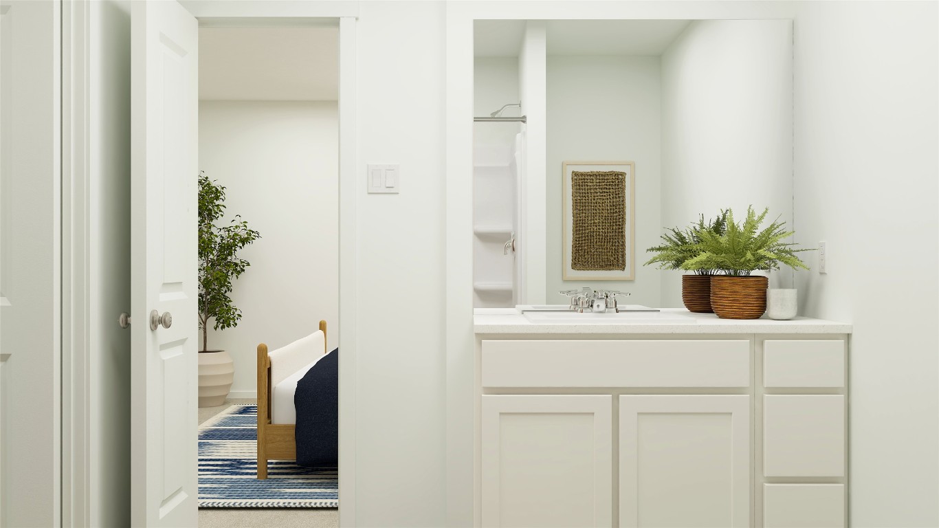 103 Heritage Grvs Road Bertram, TX 78605 - Photo 31 of 37 a bathroom with a sink a potted plant and a mirror