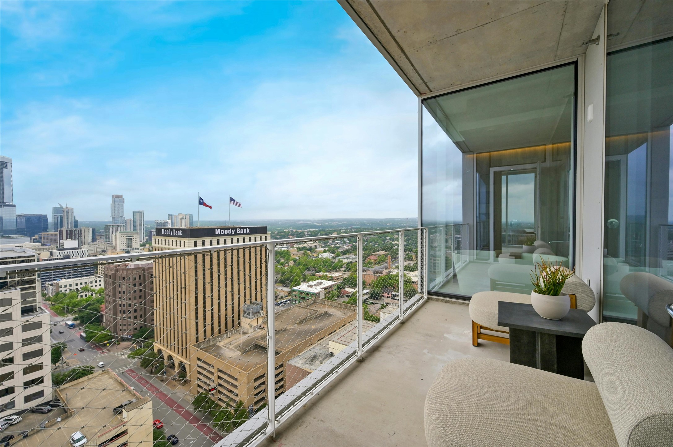 313 West 17th Street, Unit 1807 Austin, TX 78701 - Photo 18 of 39 Step outside to the balcony and immerse yourself in breathtaking views of the surrounding cityscape. This outdoor retreat offers a perfect spot to unwind and enjoy the fresh air while taking in the vibrant energy of the city.