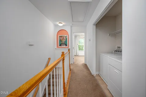 a view of hallway with washer and dryer