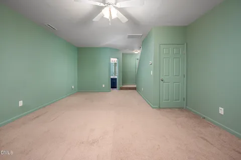 an empty room with a bathroom