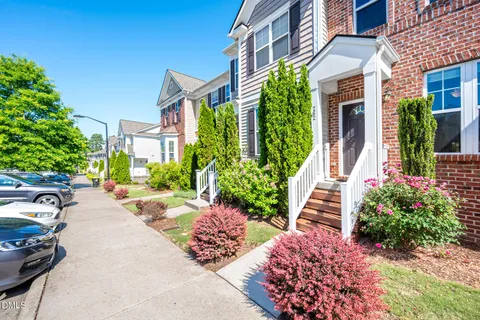 a view of a house with a yard and garden