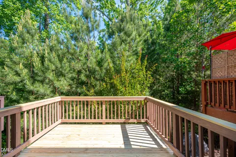 a view of balcony with wooden floor