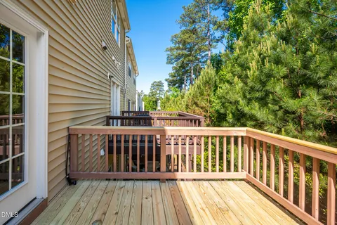 a view of balcony with wooden floor