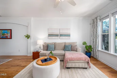 a living room with furniture and a rug