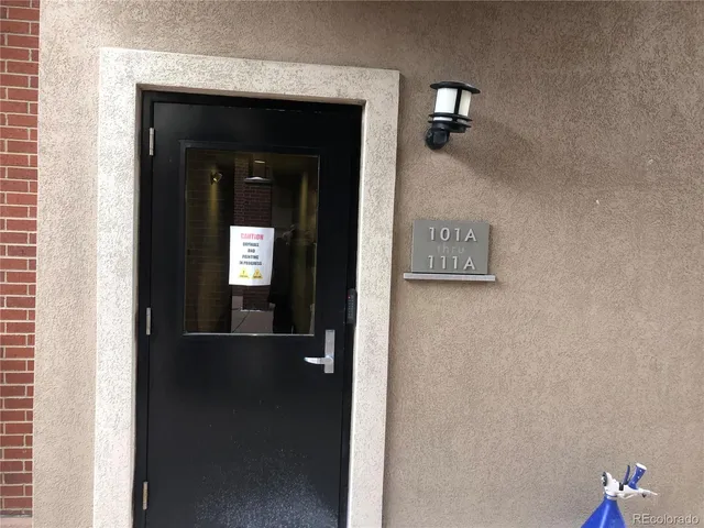 a kitchen with granite countertop a refrigerator stove and microwave