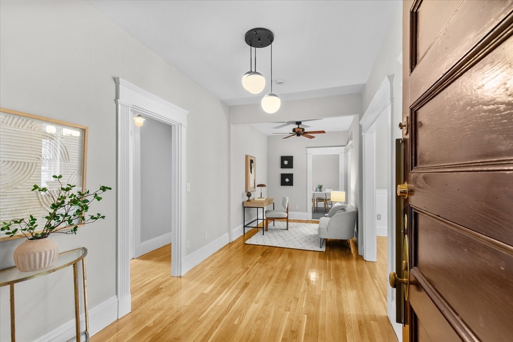 9 Verndale Street, Unit 2 Brookline, MA 02446 - Photo 2 of 39 a view of a living room with wooden floor