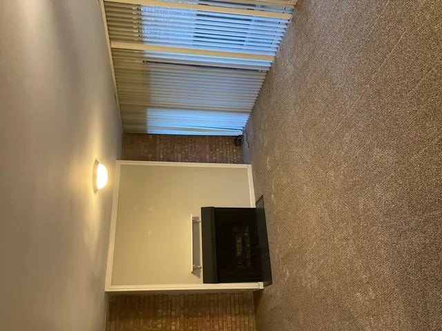 a view of a hallway with a chandelier