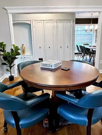 a view of a dining room with furniture and wooden floor