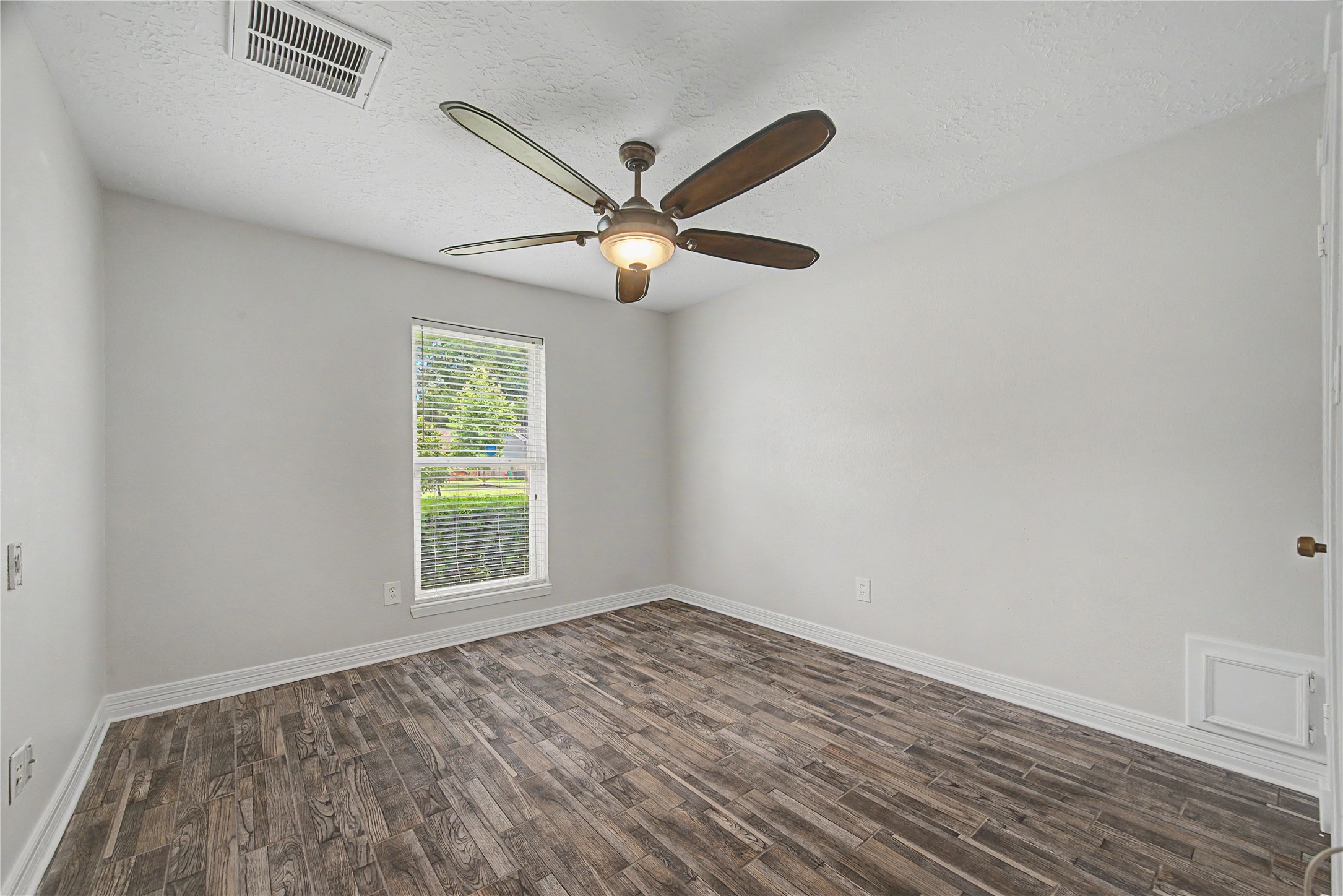 4210 Mossygate Drive Spring, TX 77373 - Photo 8 of 33 Secondary bedroom #1, located on the opposite side of the home from the primary suite.