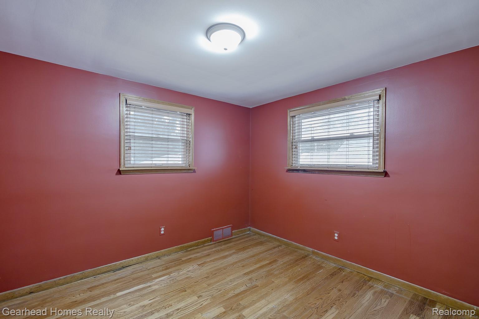 3356 Harding Street Dearborn, MI 48124 - Photo 21 of 48 Wood-finish flooring, two windows with blinds, and flush-mount ceiling light