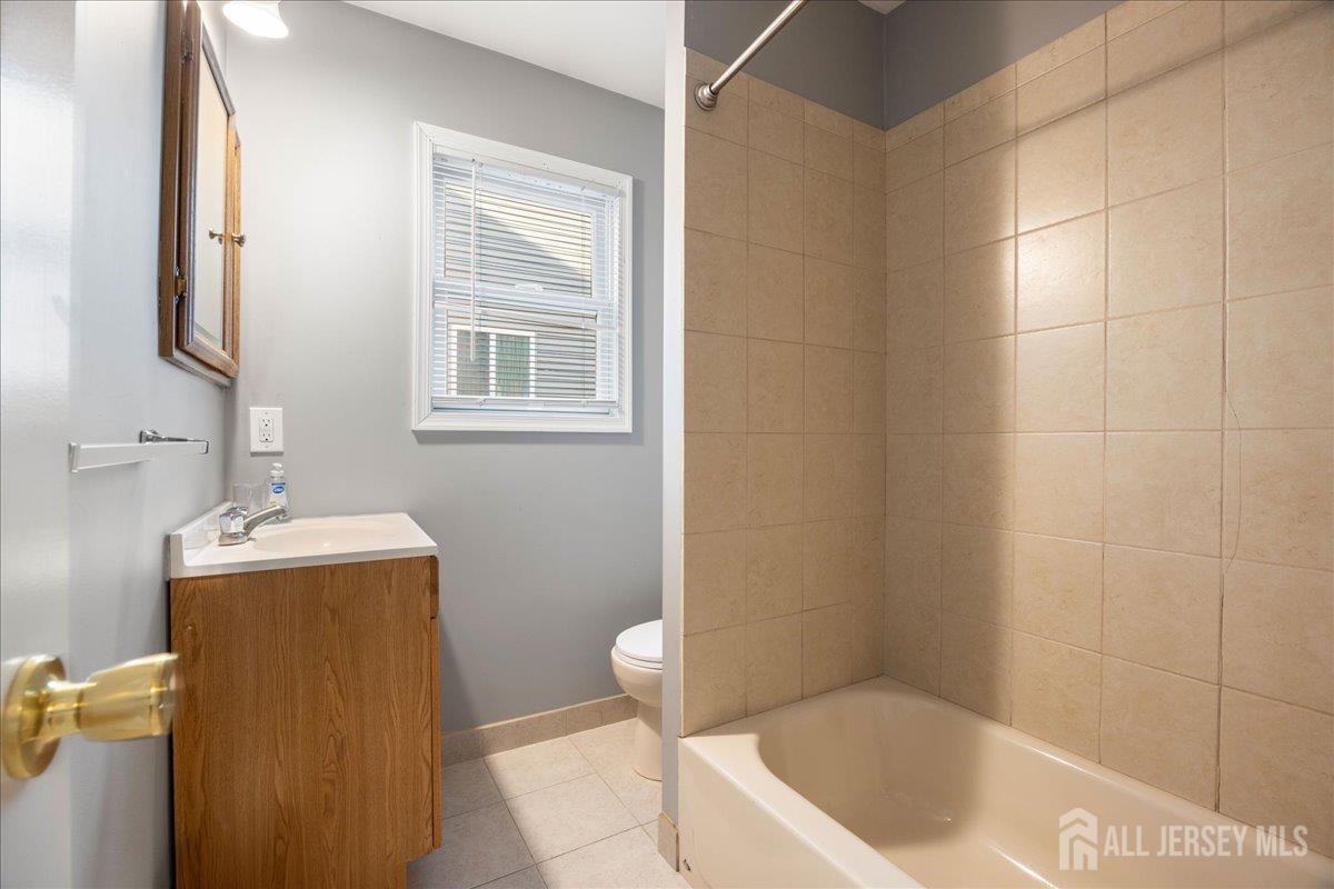 281 Prospect Avenue Old Bridge, NJ 08879 - Photo 13 of 29 a bathroom with a tub sink and vanity