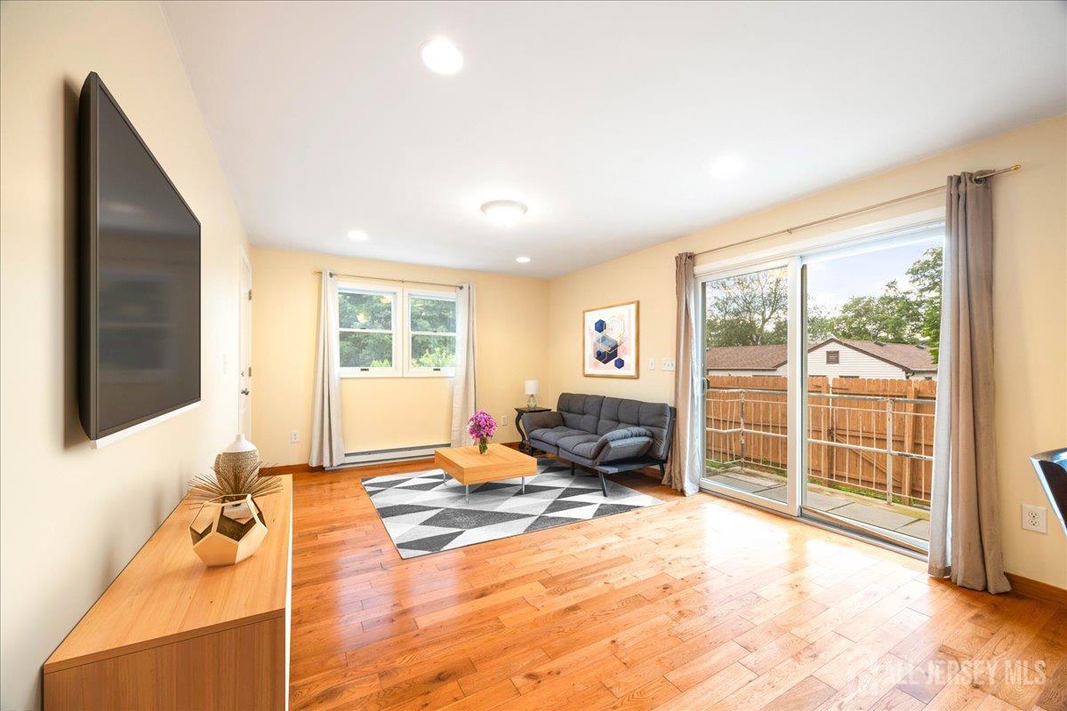 281 Prospect Avenue Old Bridge, NJ 08879 - Photo 15 of 29 a spacious bedroom with a large bed and a flat tv screen next to a window