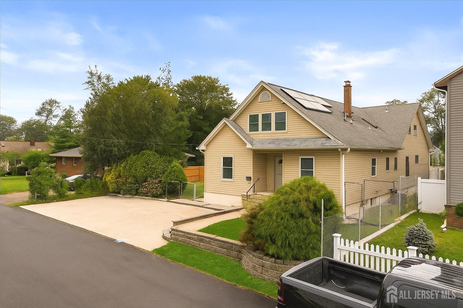 281 Prospect Avenue Old Bridge, NJ 08879 - Photo 2 of 29 a front view of a house with a yard