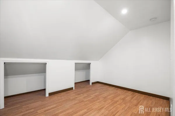 a view of an empty room and wooden floor