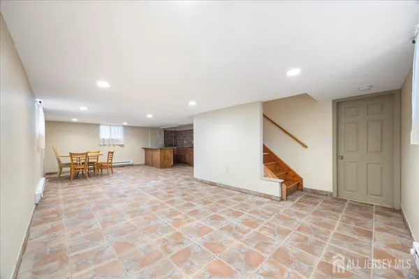 a view of a livingroom with furniture and an entryway