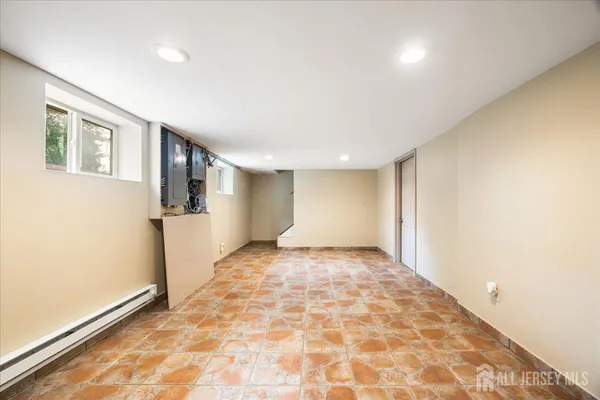 a view of an empty room and a window