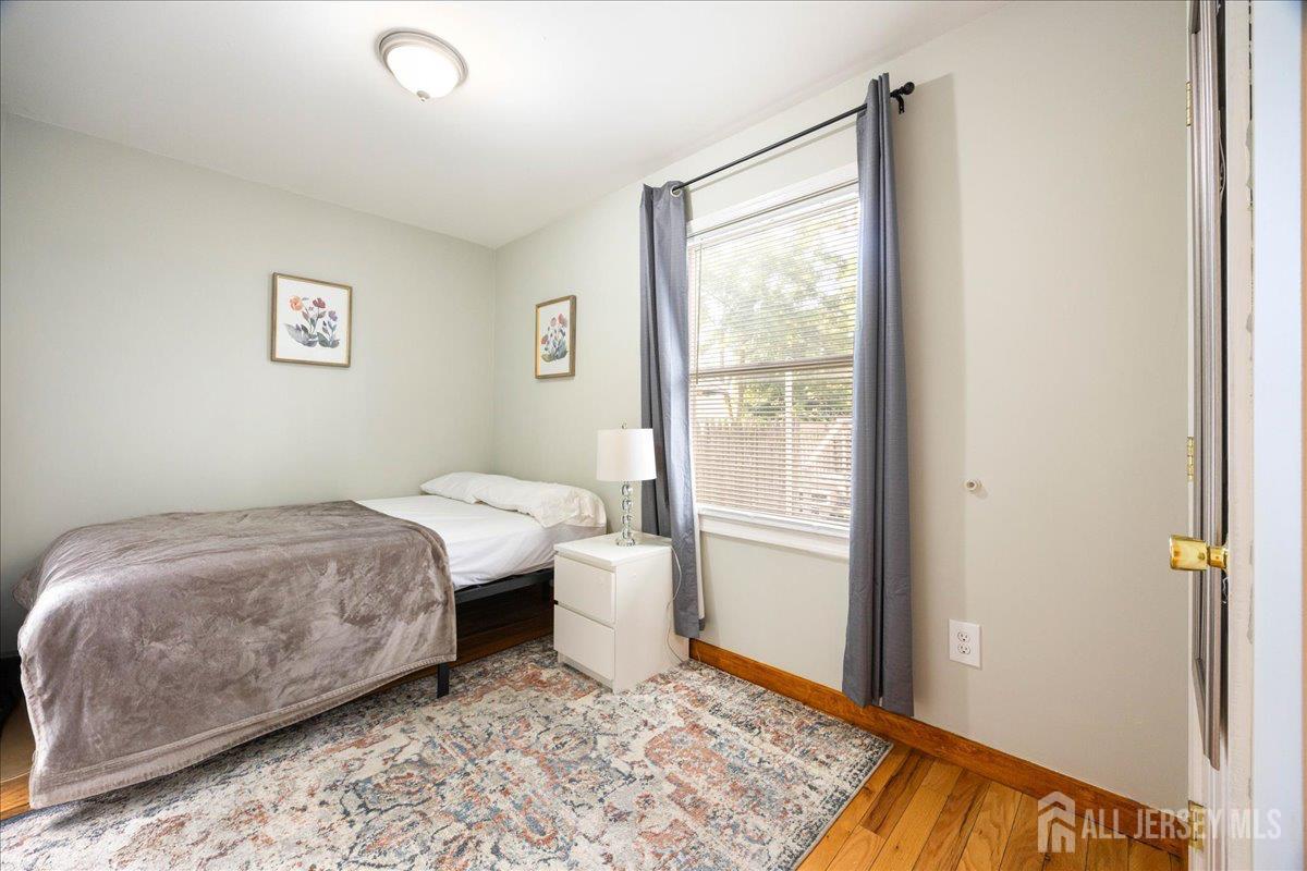 281 Prospect Avenue Old Bridge, NJ 08879 - Photo 10 of 29 a room with a bed and a window