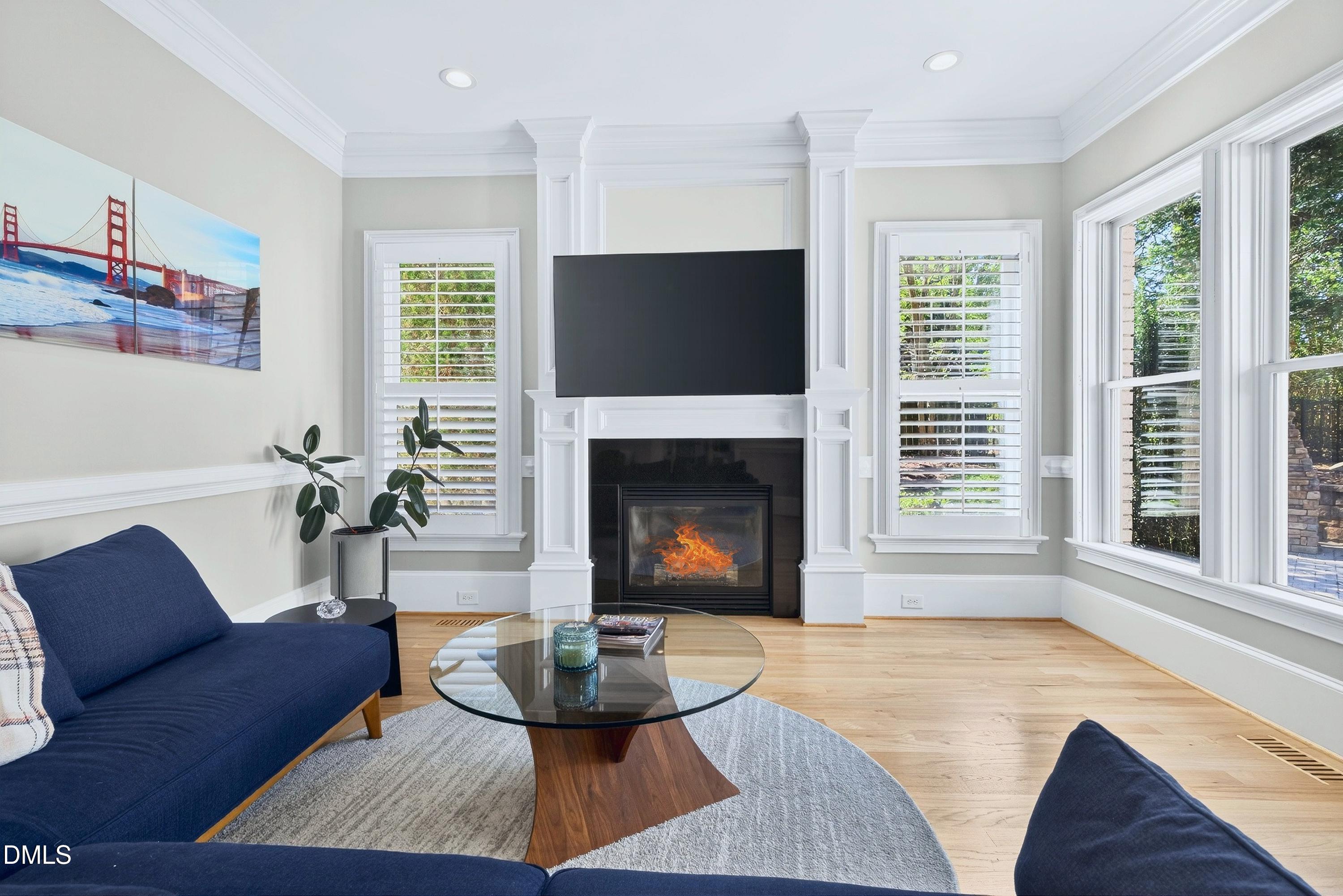 6701 Foxfire Place Raleigh, NC 27615 - Photo 29 of 67 a living room with furniture and a fireplace