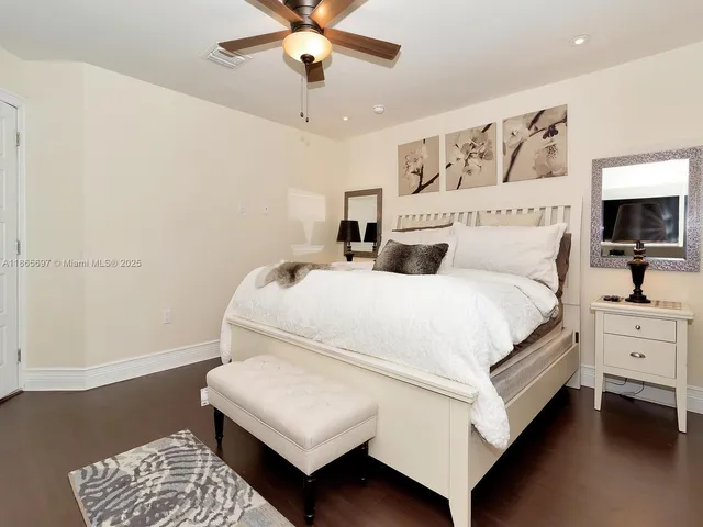 a bed room with a bed and a chandelier