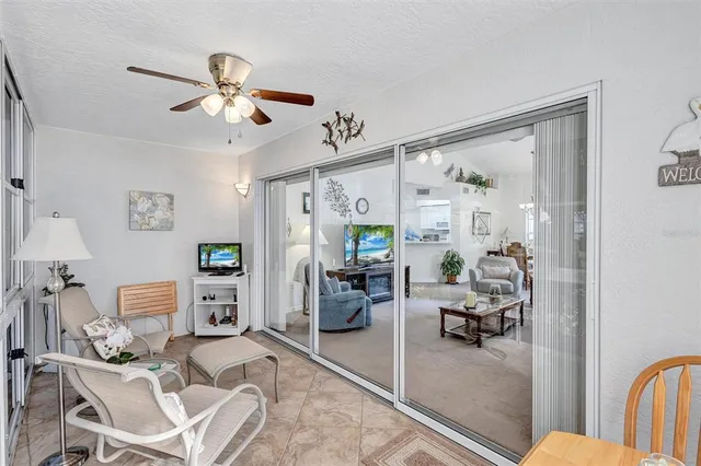 a view of a livingroom with furniture and workspace