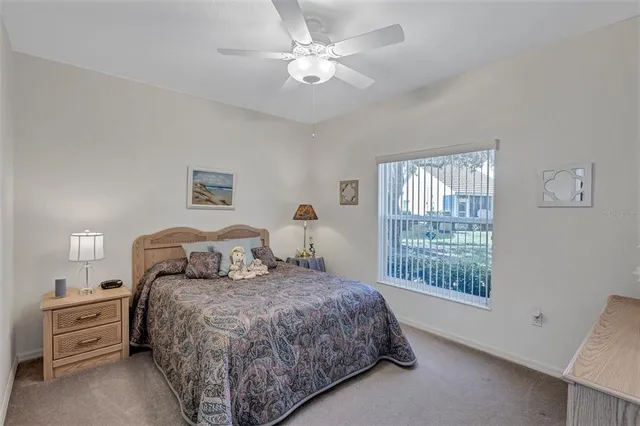 a bed room with a bed and a chandelier