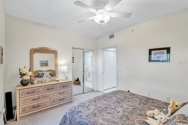 a bedroom with a bed and a dresser