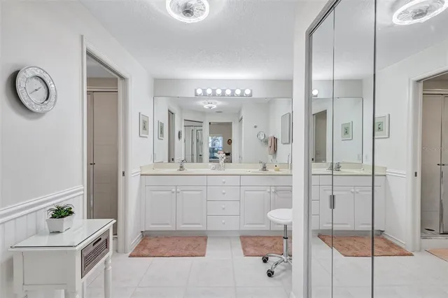 a bathroom with a bathtub shower sink and toilet