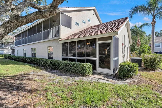 a view of a house with a yard and plants