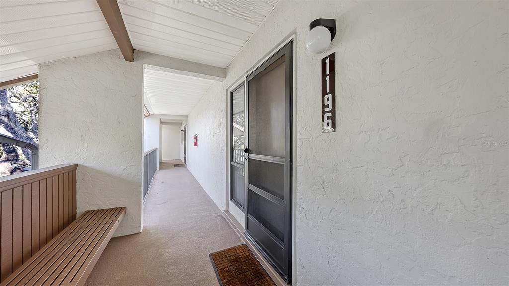 1196 Bird Bay Way, Unit 310 Venice, FL 34285 - Photo 2 of 37 a view of hallway with stairs