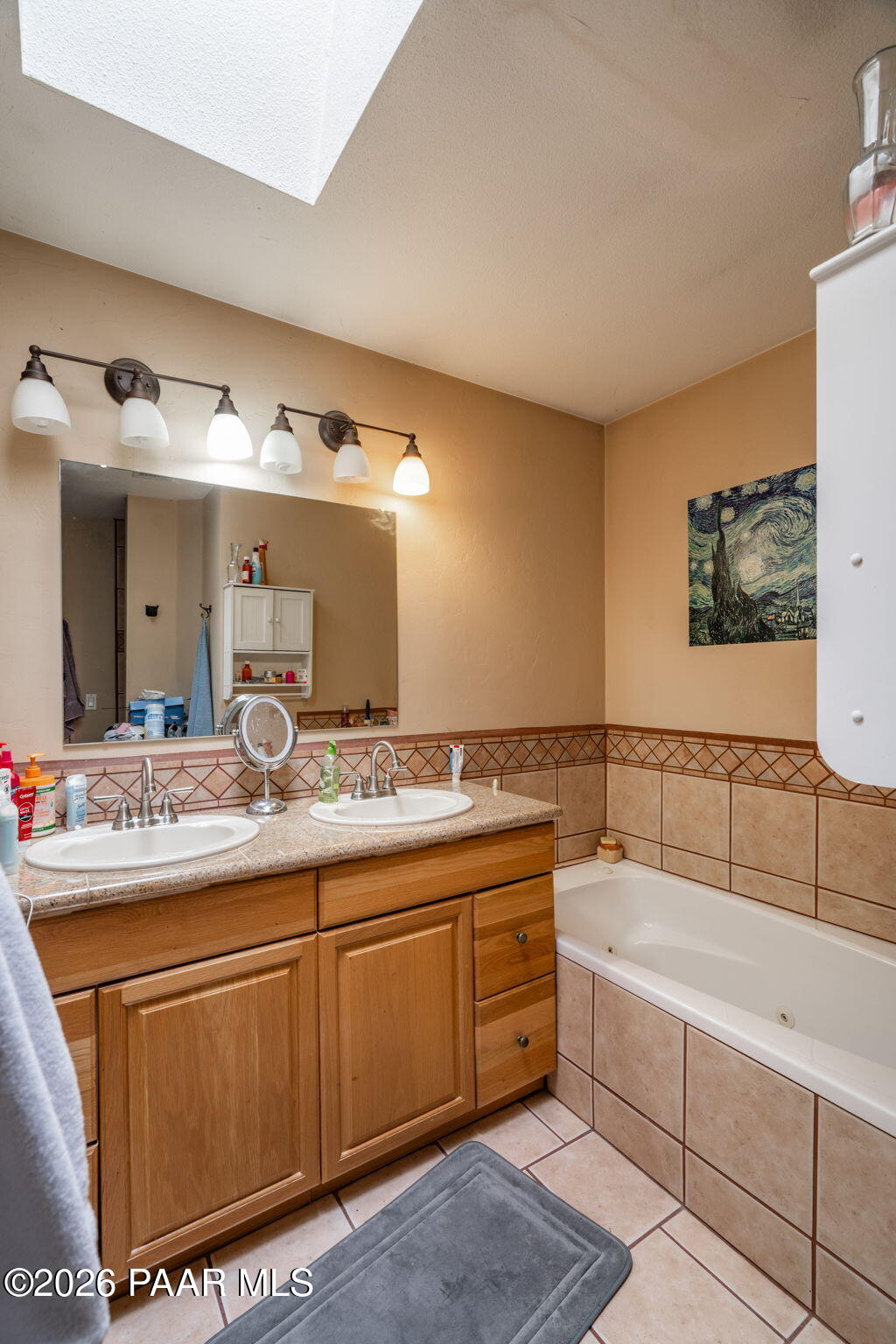 1710 Grandview Road Prescott, AZ 86305 - Photo 17 of 47 a bathroom with a granite countertop sink a mirror and a bathtub