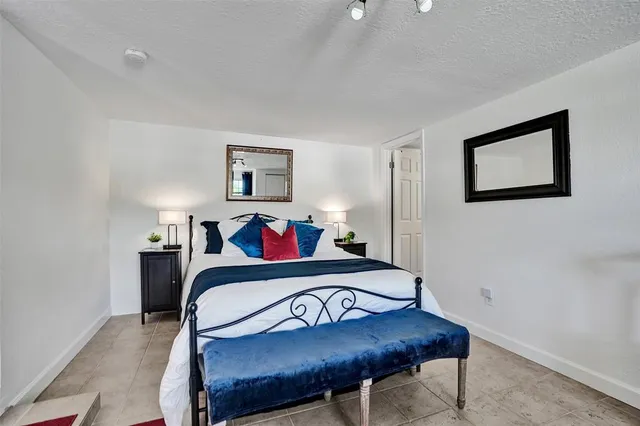 a bedroom with a bed and a table