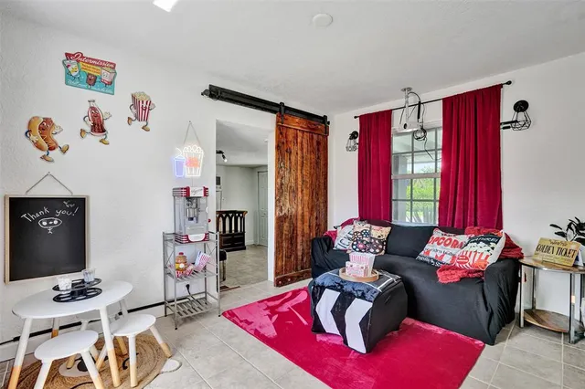 a bedroom with furniture and a window