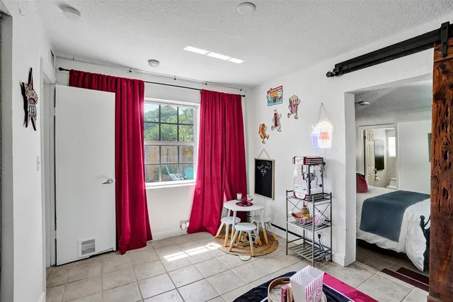 a view of a livingroom with furniture and a window