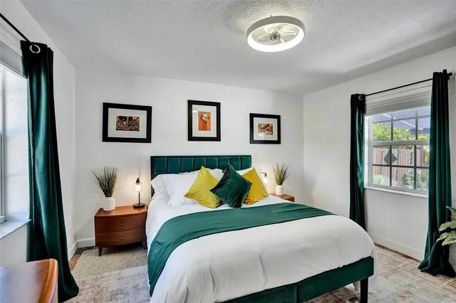 a bedroom with a bed and a window