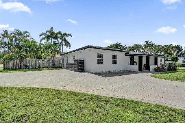 a view of a backyard of the house