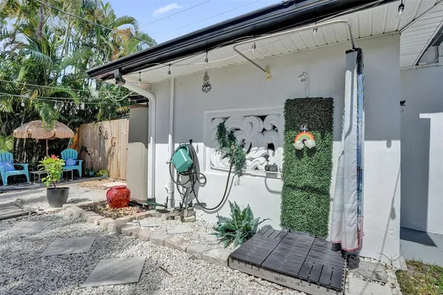 a view of potted plants in front of retail building