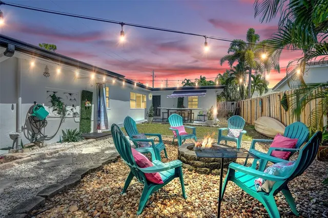 a patio with tables and chairs