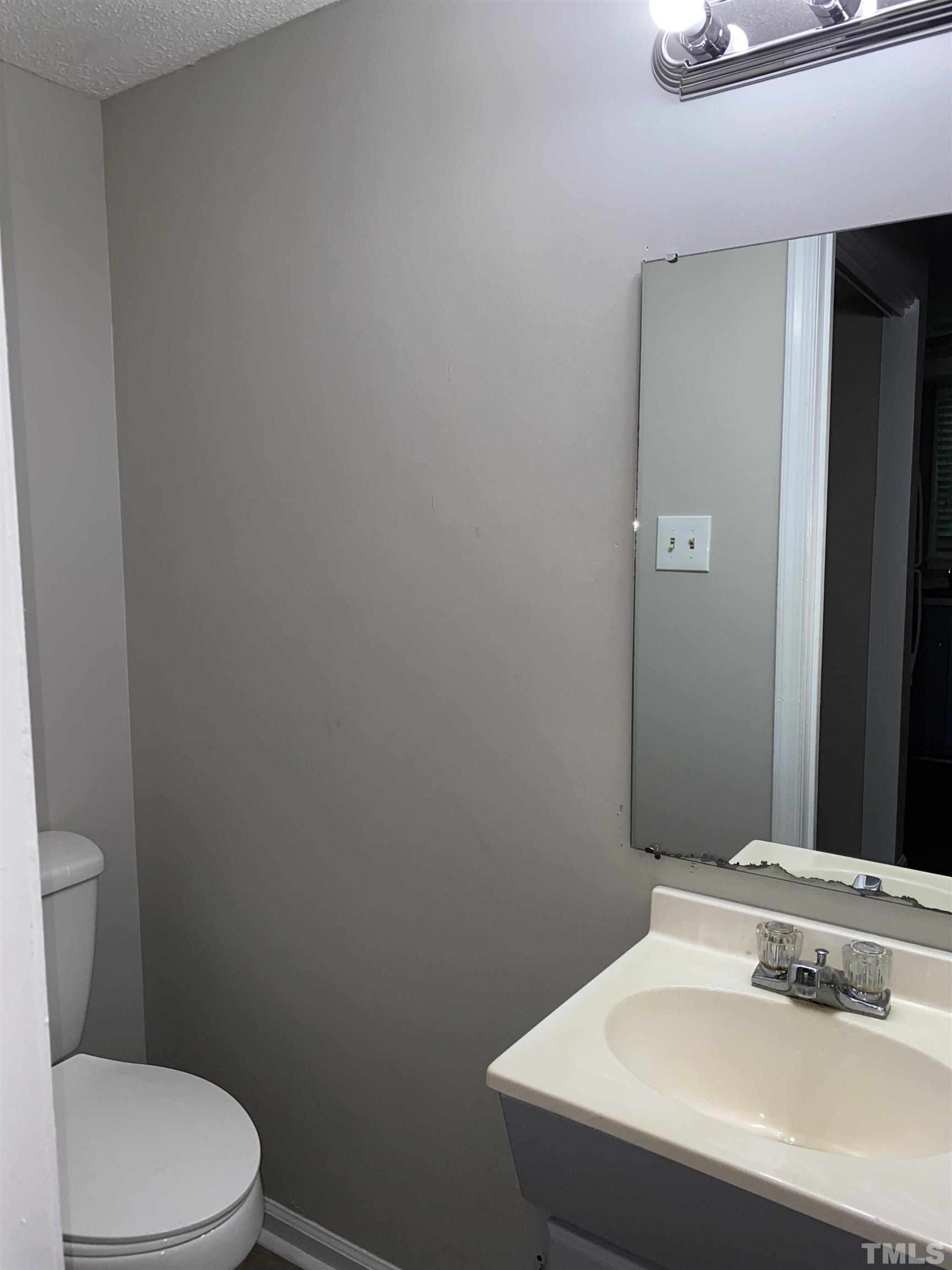 1254 Donaldson Court Cary, NC 27511 - Photo 5 of 8 a bathroom with a sink and a toilet