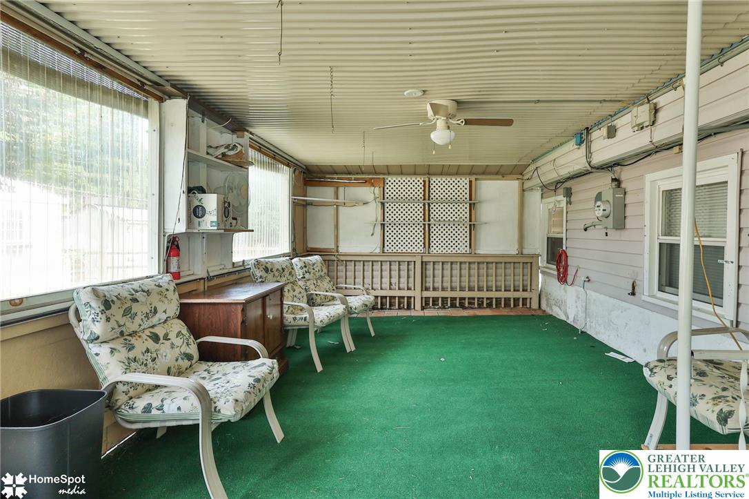 3069 Shakespeare Road Bethlehem, PA 18017 - Photo 41 of 50 A relaxed enclosed porch with a vibrant green carpet and ample seating for leisure. Windows can be pulled up for extra ventilation and openess.