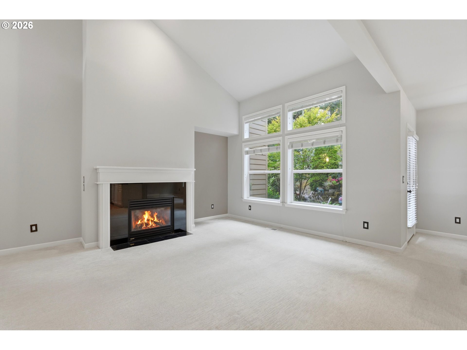 8 Summit Ridge Court Lake Oswego, OR 97035 - Photo 8 of 40 a view of an empty room with a window and fireplace