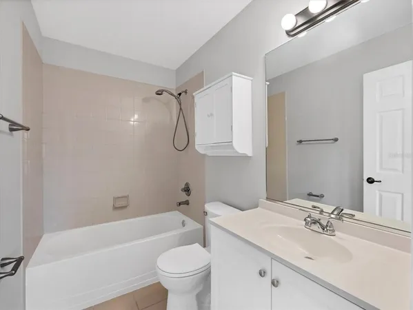 a bathroom with a sink a toilet and a bathtub