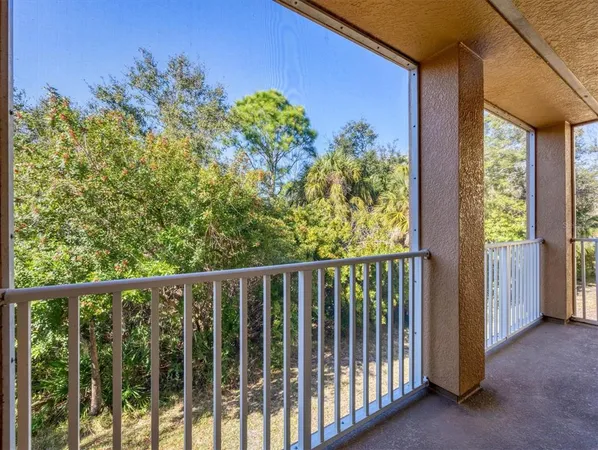 a view of a balcony with plants