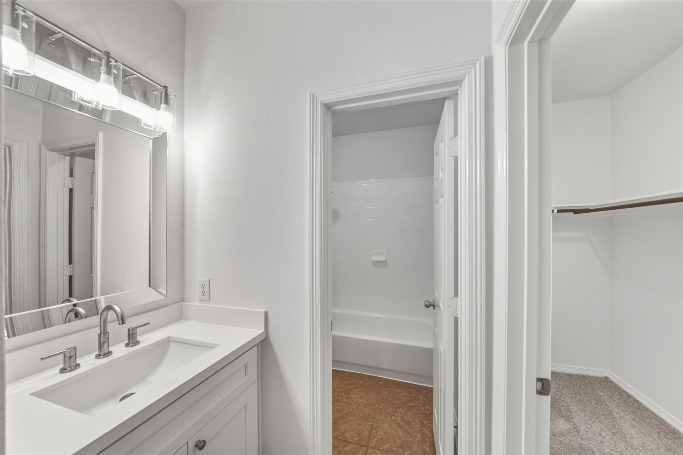 3103 Trail Ridge Drive Pearland, TX 77584 - Photo 22 of 35 a bathroom with a sink vanity granite and a mirror