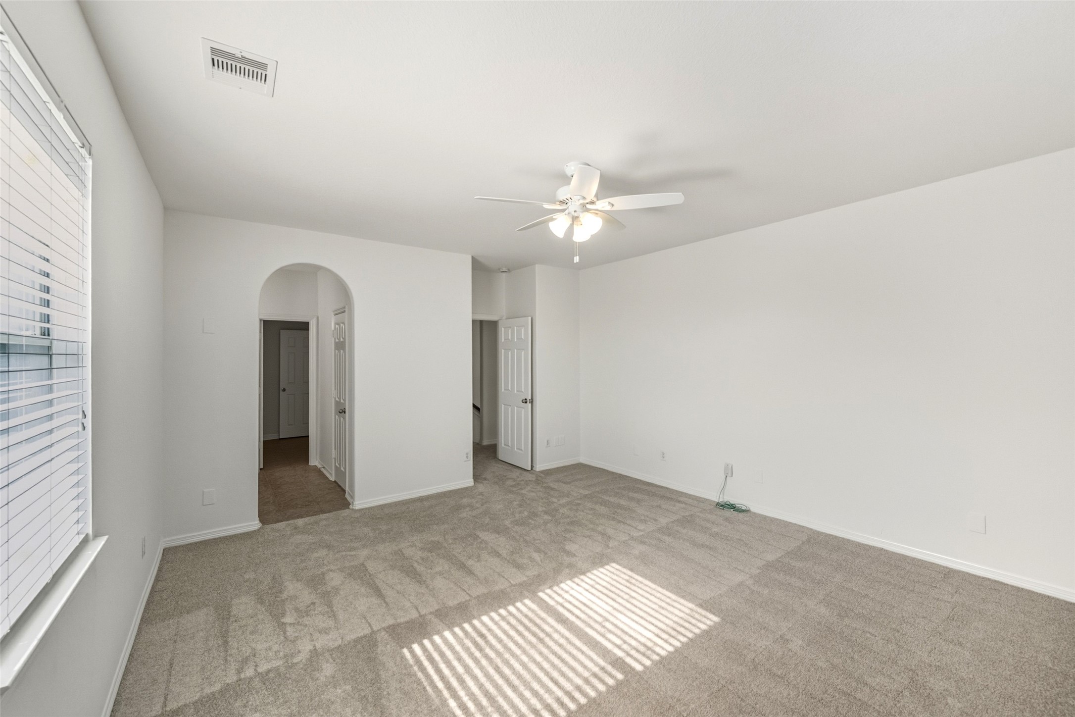 3103 Trail Ridge Drive Pearland, TX 77584 - Photo 25 of 35 a view of a room with a ceiling fan and window