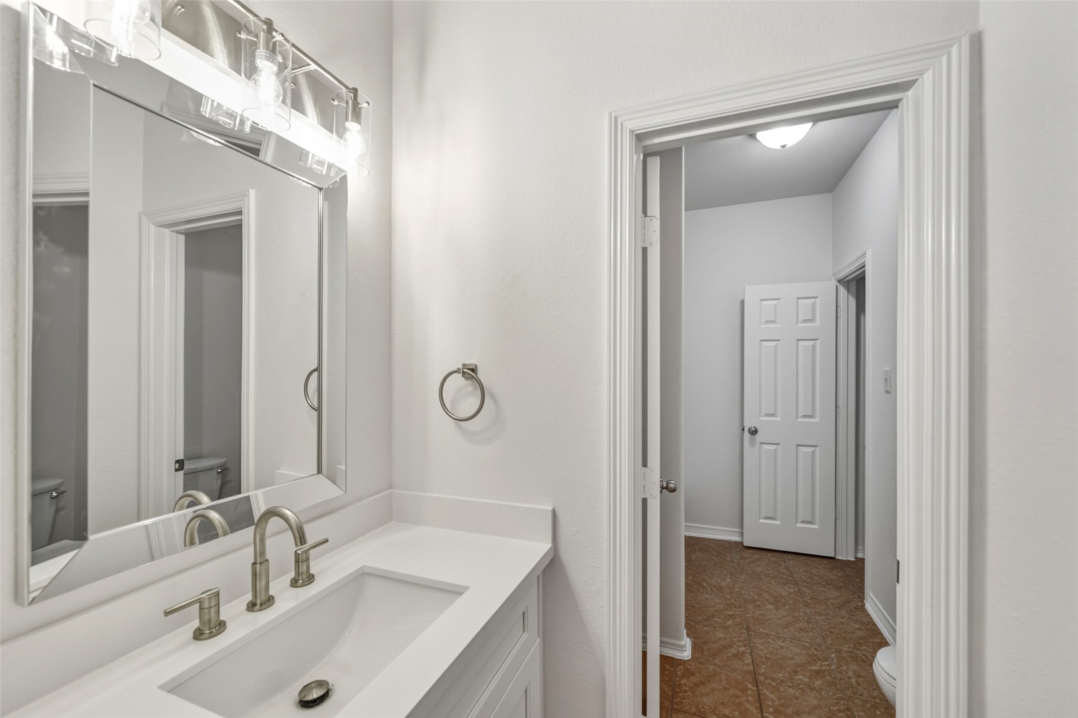 3103 Trail Ridge Drive Pearland, TX 77584 - Photo 26 of 35 a bathroom with a sink and a mirror