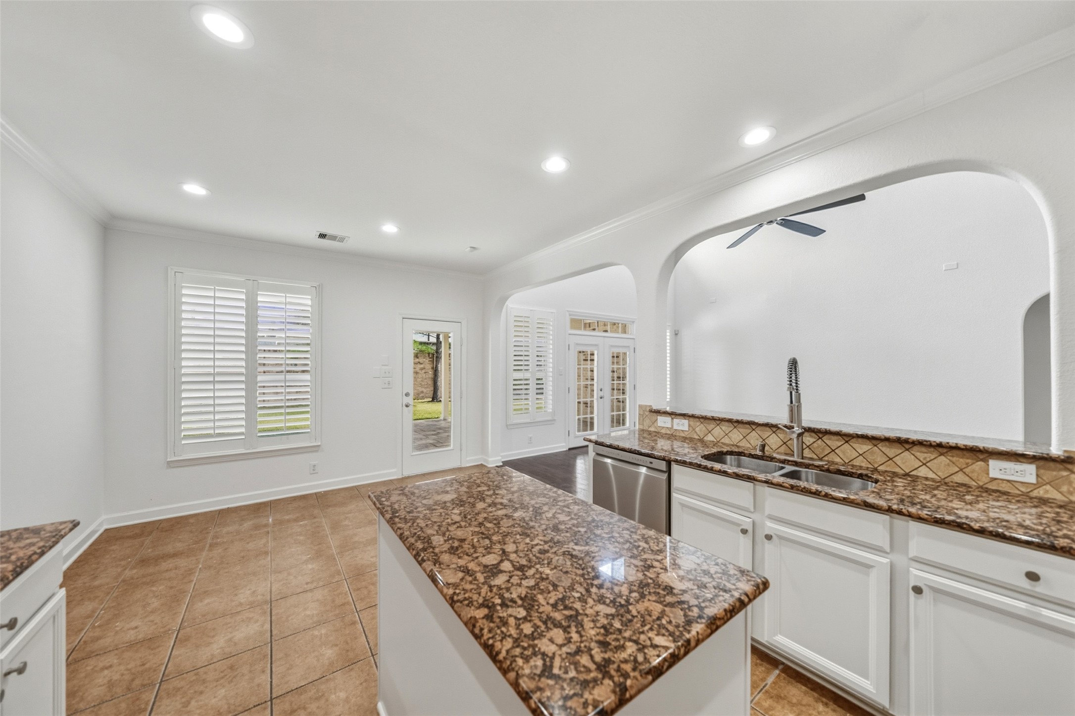 3103 Trail Ridge Drive Pearland, TX 77584 - Photo 7 of 35 a kitchen with stainless steel appliances granite countertop a sink stove and cabinets